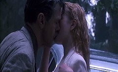 Drew Barrymore making out with a guy on the hood of a car