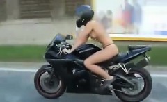 Topless Tattooed Chick Riding A Motorcycle