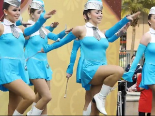 Hot young majorettes in blue flash their sexy legs as they