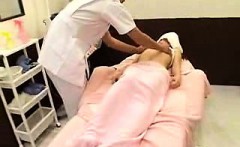 Beautiful Oriental teen has a horny masseur caressing her h